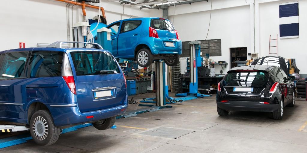 Workshop bays with cars on lifts